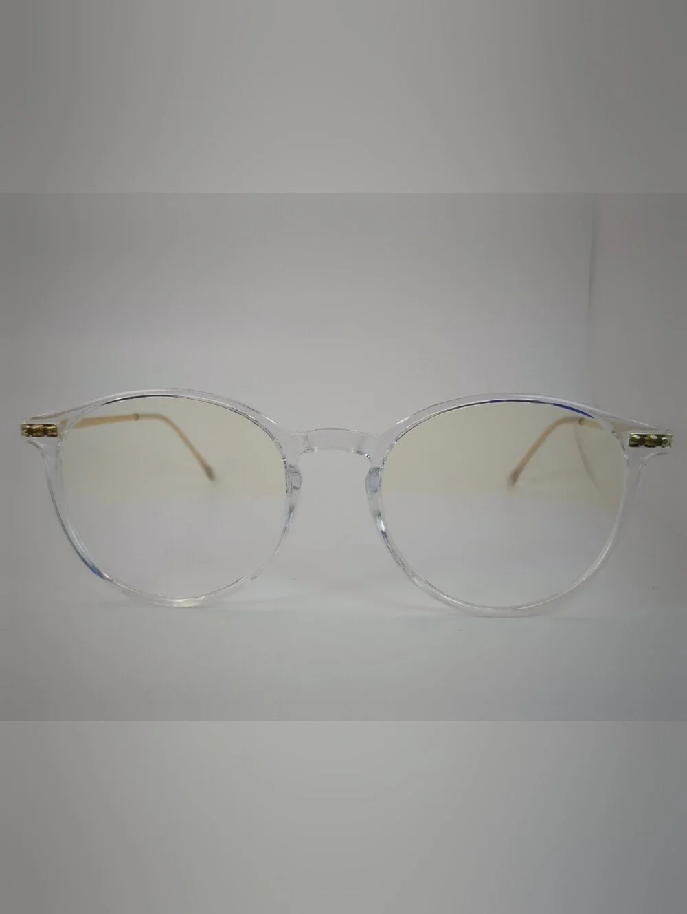 Amity. Clear Round Frame Glasses with Subtle Gold Temples. Opthalmic